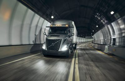 Volvo VNR driving through a tunnel